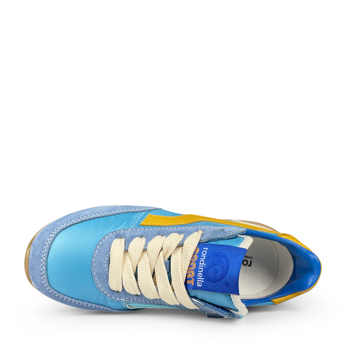Bovenaanzicht van de Rondinella Runner kinderschoen met witte veters en blauw label op de tong