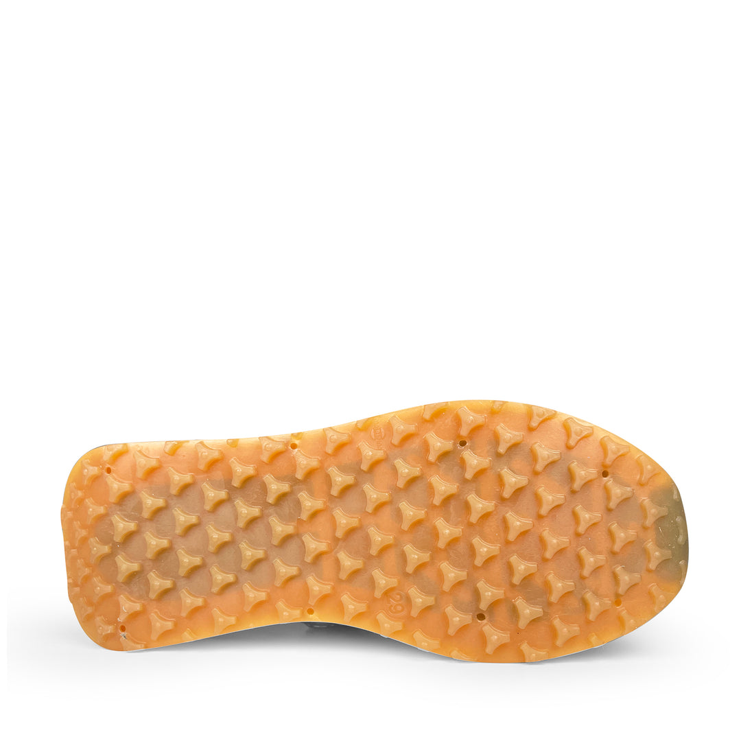 Zool van de Rondinella kindersneaker met oranje rubberen noppenprofiel voor extra grip