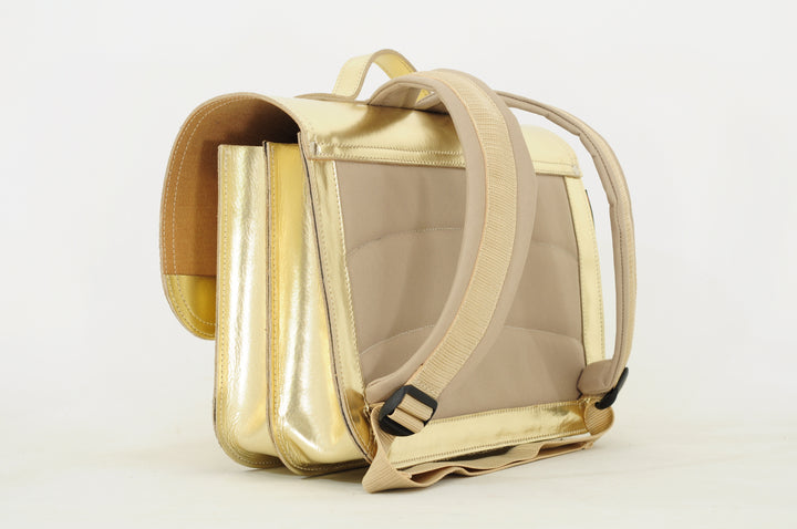 Comfortabele kinderrugzak met verstelbare schouderbanden en gouden details – Own Stuff boekentas