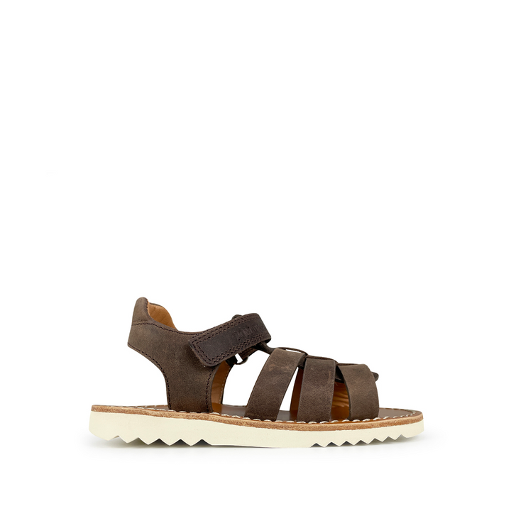 Brown sandal on white sole