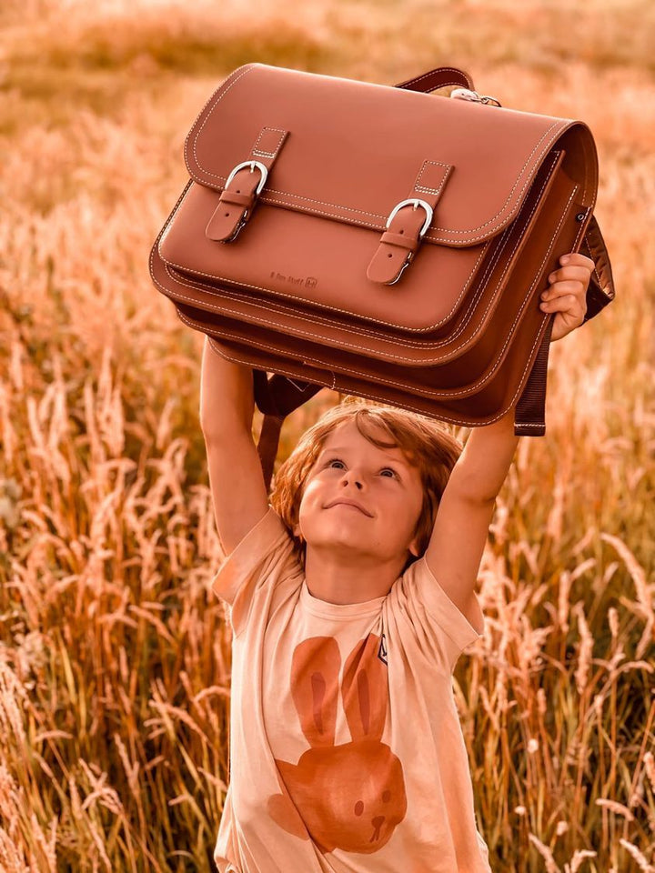 Leather school bag in cognac/brown with buckle closure