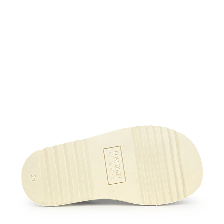 Brown sandal on white sole