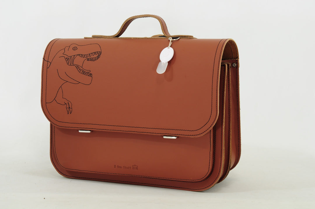 Cognac leather dino book bag with magnetic closure