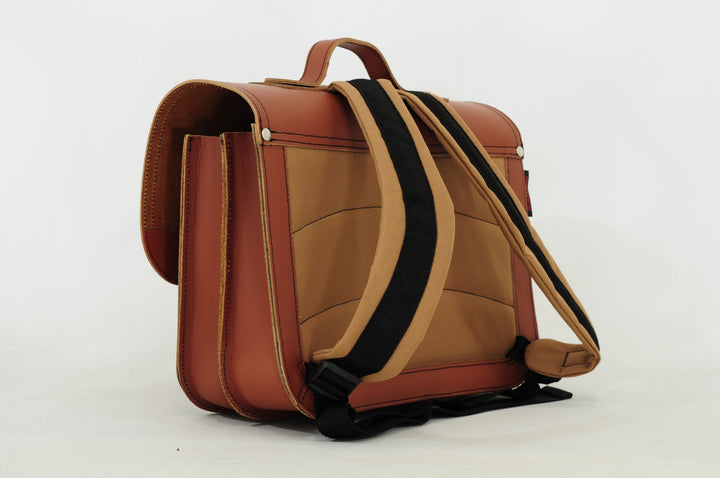 Cognac leather dino book bag with magnetic closure