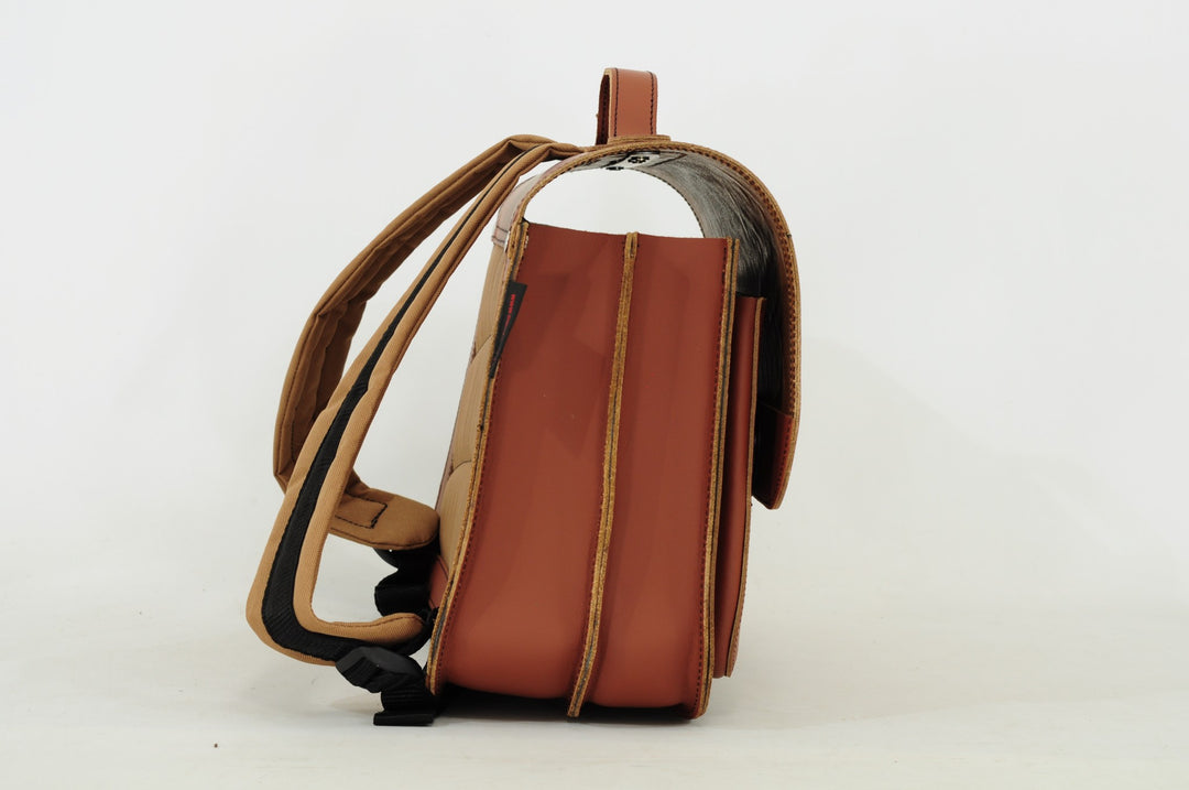 Cognac leather dino book bag with magnetic closure