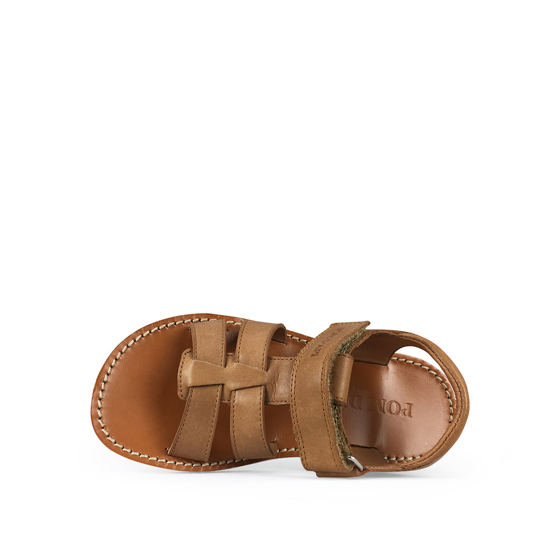 Brown sandal on white sole