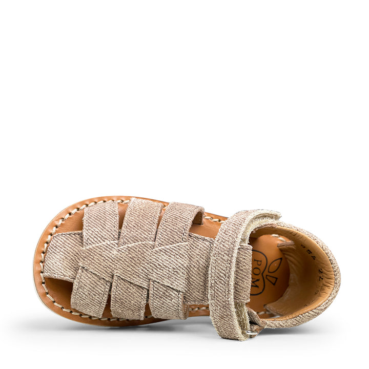 Brown sandal on white sole